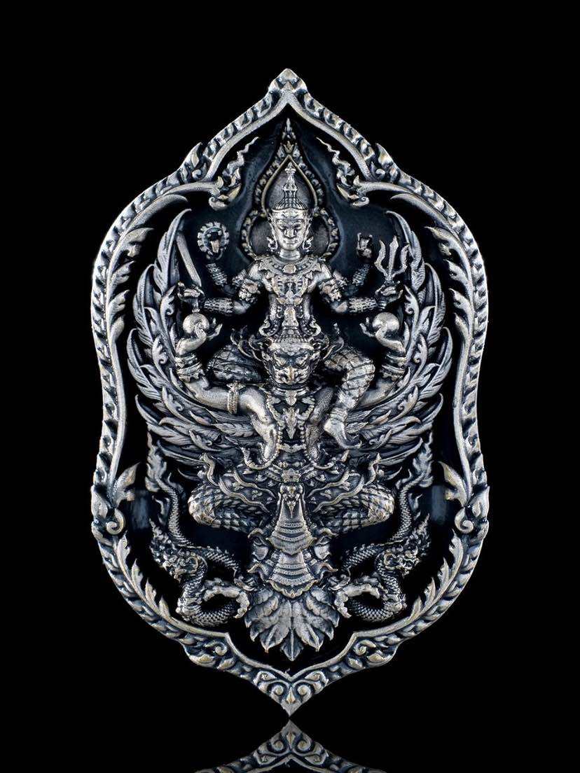 Intricately designed Thai lucky coin for wealth and protection featuring spiritual symbols and ornate details