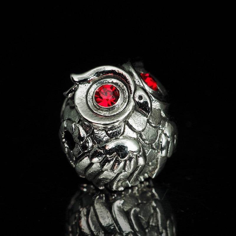 Thai owl charm for luck and prosperity in silver with red gemstones, perfect for home decor