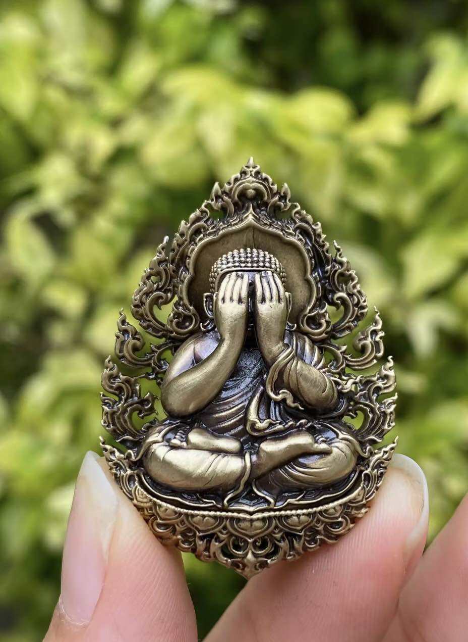 Thai Phra Pidta amulet for protection featuring a detailed design of a meditating figure