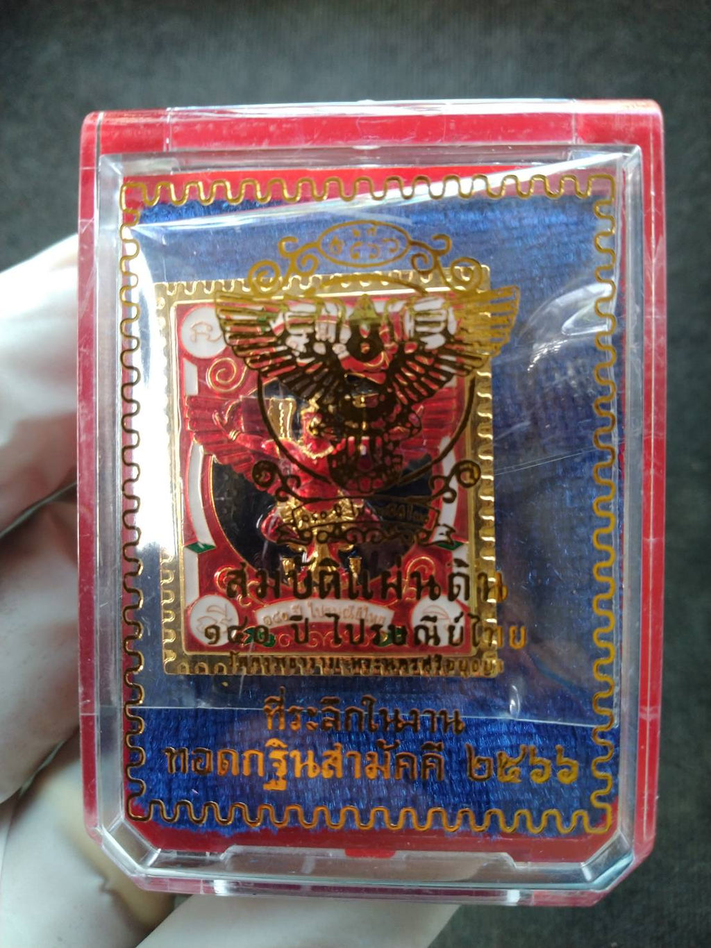 Garuda stamp medallion Thai Post gold plated medallion in clear red plastic display case with Thai script backing