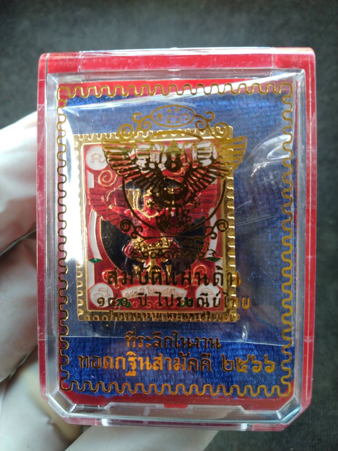 Garuda stamp medallion Thai Post gold plated medallion in clear red plastic display case with Thai script backing