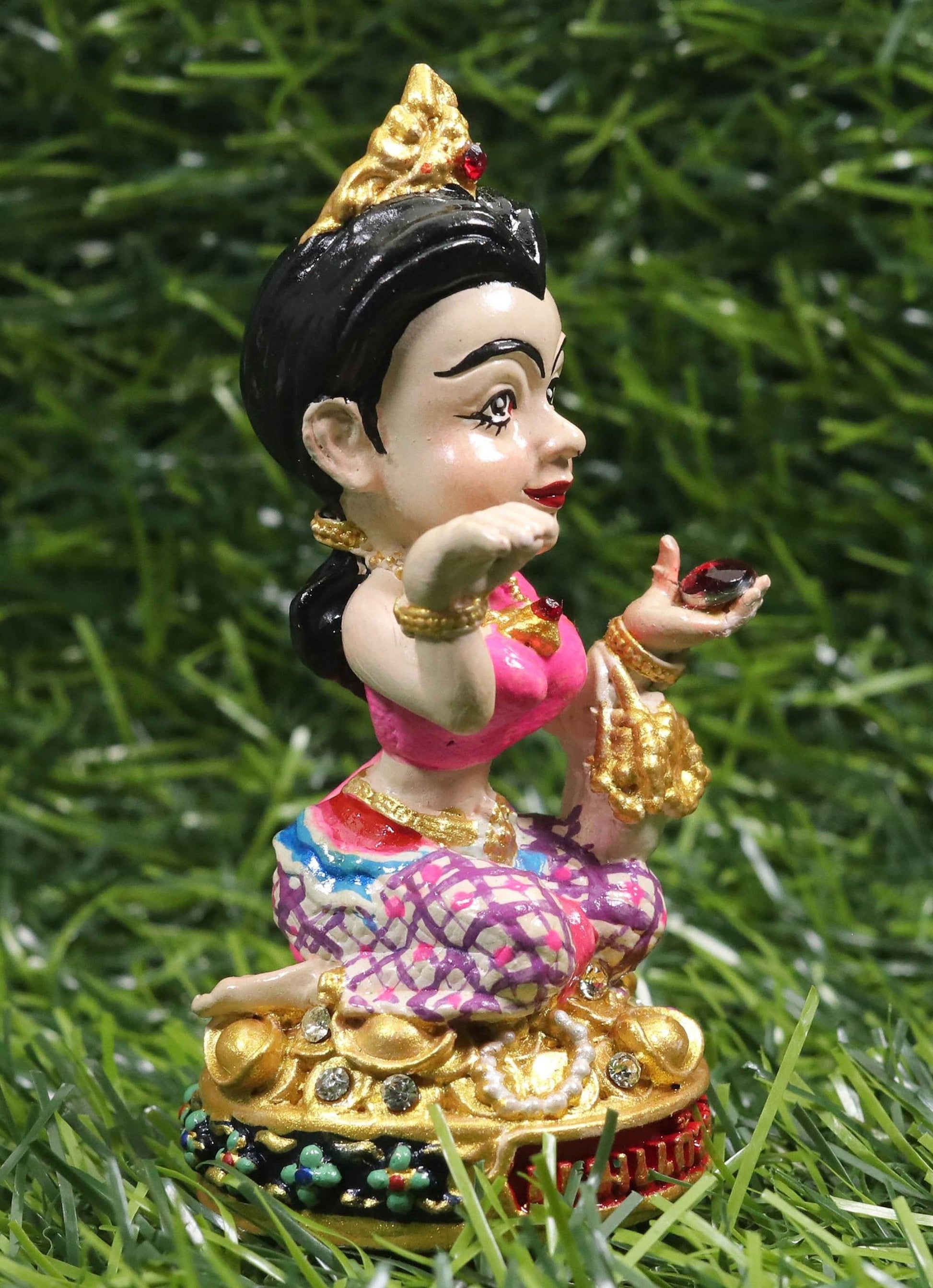 Thai prosperity figurine for shop decor featuring a colorful traditional female figure sitting on a gold base