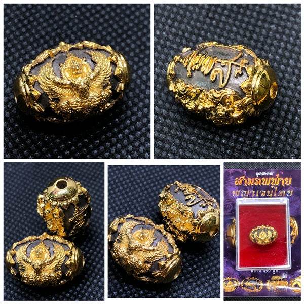 Beautiful Thai protection amulet for prosperity featuring intricate gold designs and crafting details