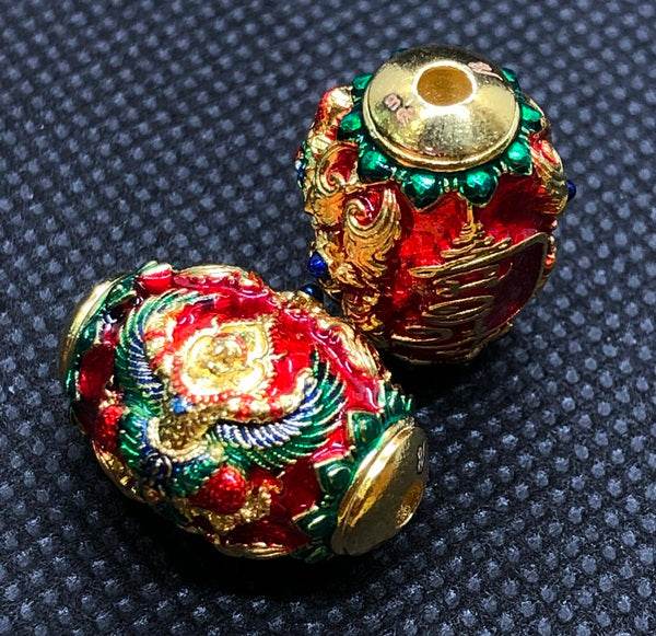 Colorful Thai protection amulet for prosperity featuring intricate designs and golden accents