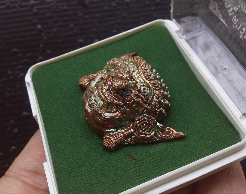 Thai protection amulet Rahu by Thai Blessing Co displayed in a protective case with green felt lining