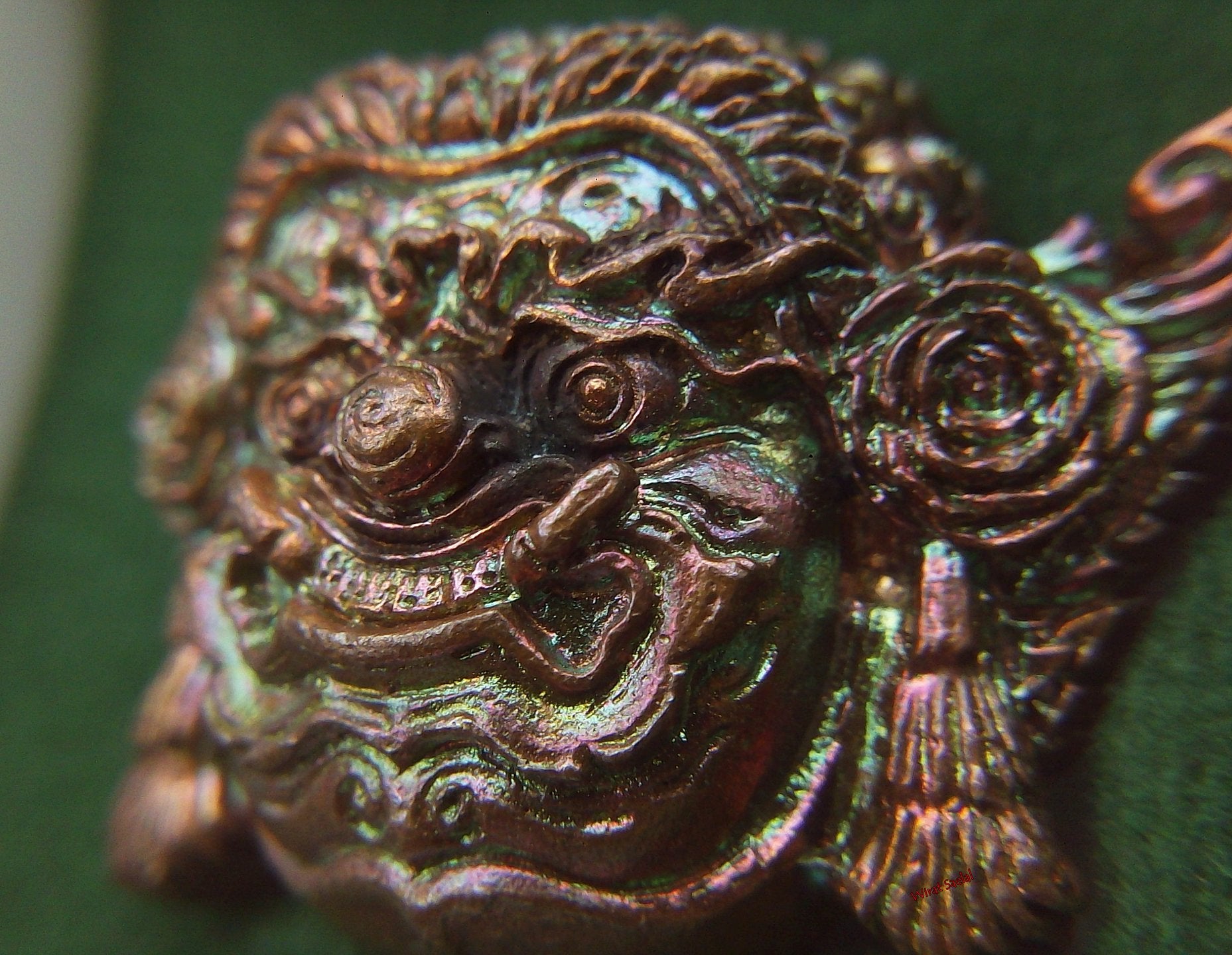 Thai protection amulet Rahu intricately designed with vibrant colors and detailed features