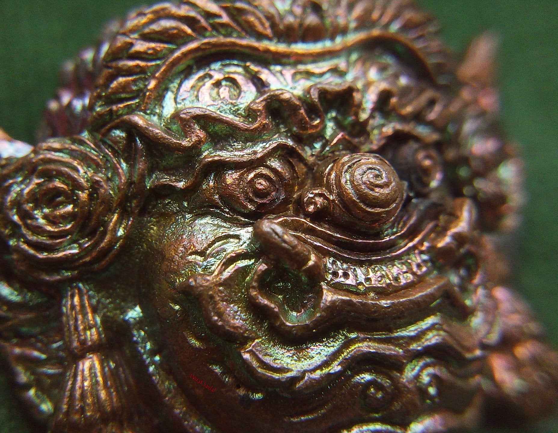Detailed Close-Up of Thai Protection Amulet Rahu with Intricate Design and Bronze Finish