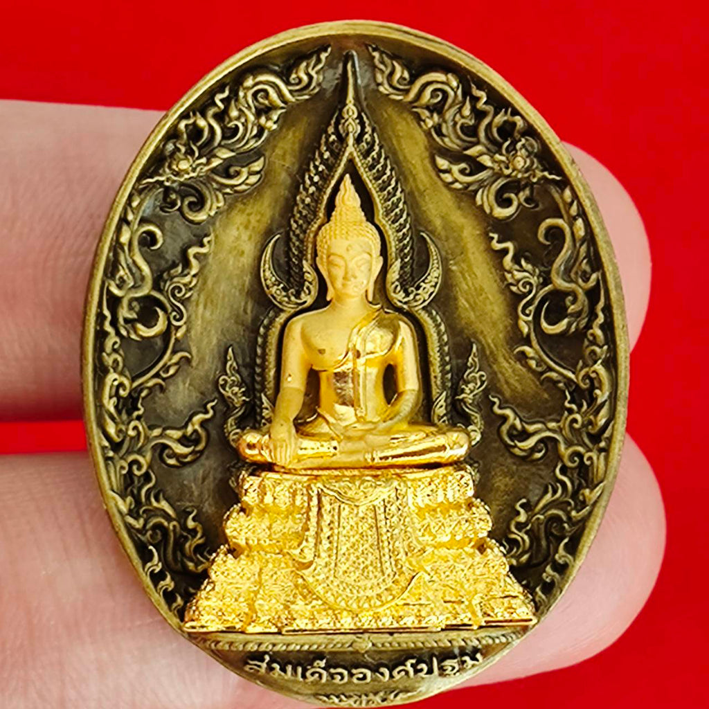 Thai protection fortune blessing charm featuring a detailed golden Buddha statue on an ornate background