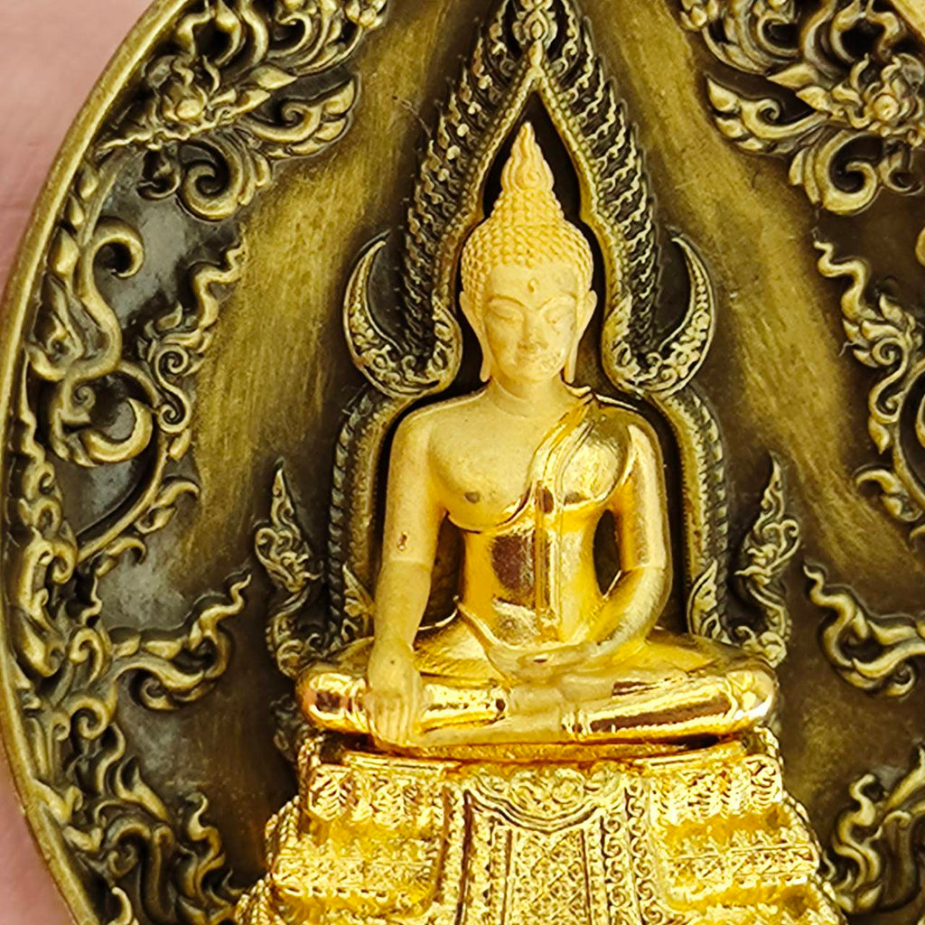 Thai protection fortune blessing charm featuring a detailed Buddha statue design on a decorative plaque