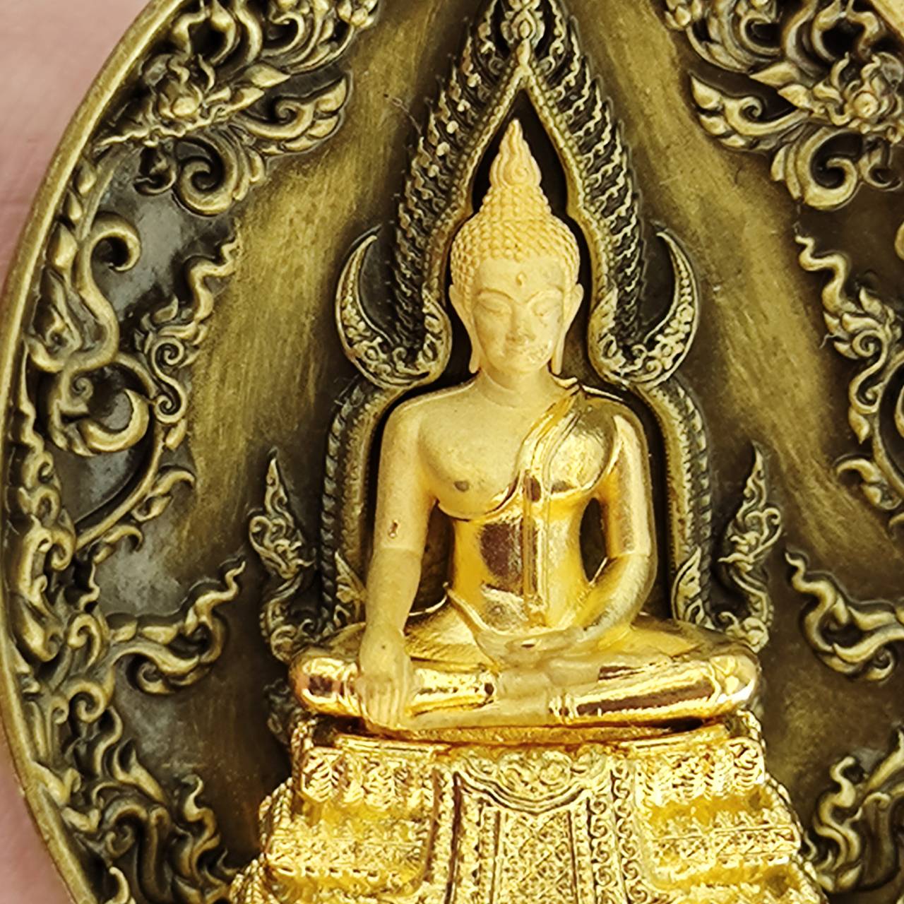 Thai protection fortune blessing charm featuring a detailed Buddha statue design on a decorative plaque