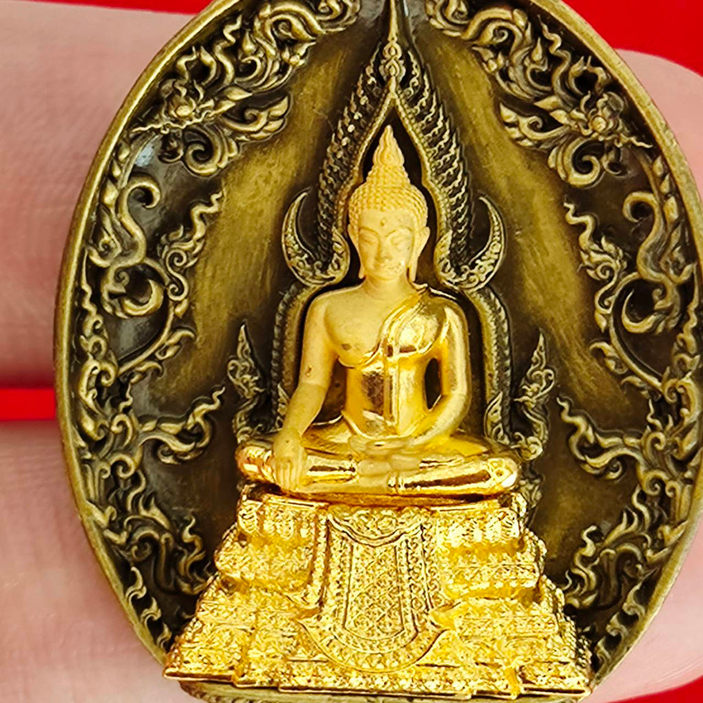 Thai protection fortune blessing charm featuring a golden Buddha statue with intricate detailing