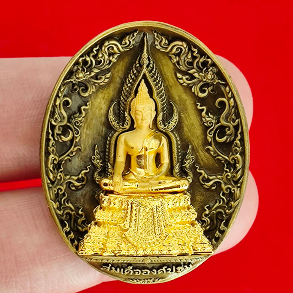 Thai protection fortune blessing charm featuring a detailed Buddha statue on an ornate background