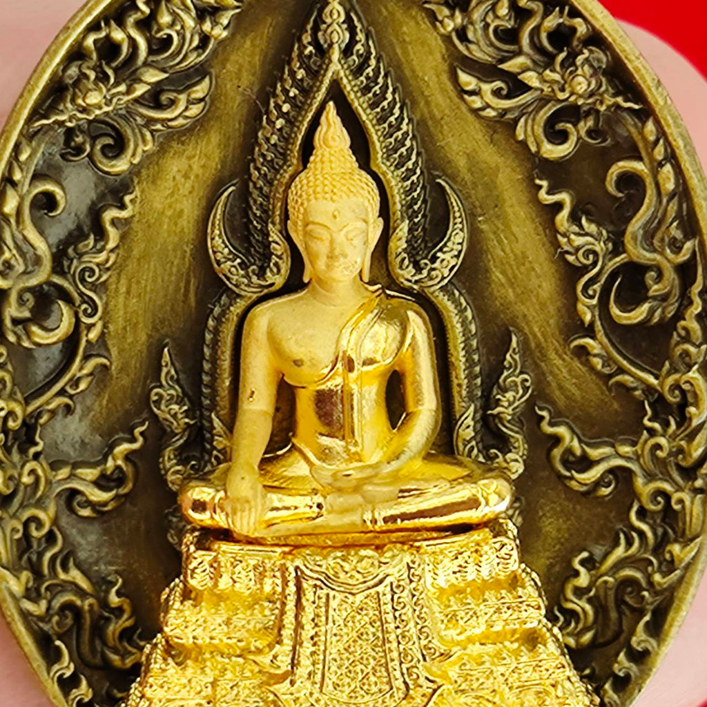 Thai protection fortune blessing charm featuring a detailed golden Buddha statue on ornate background