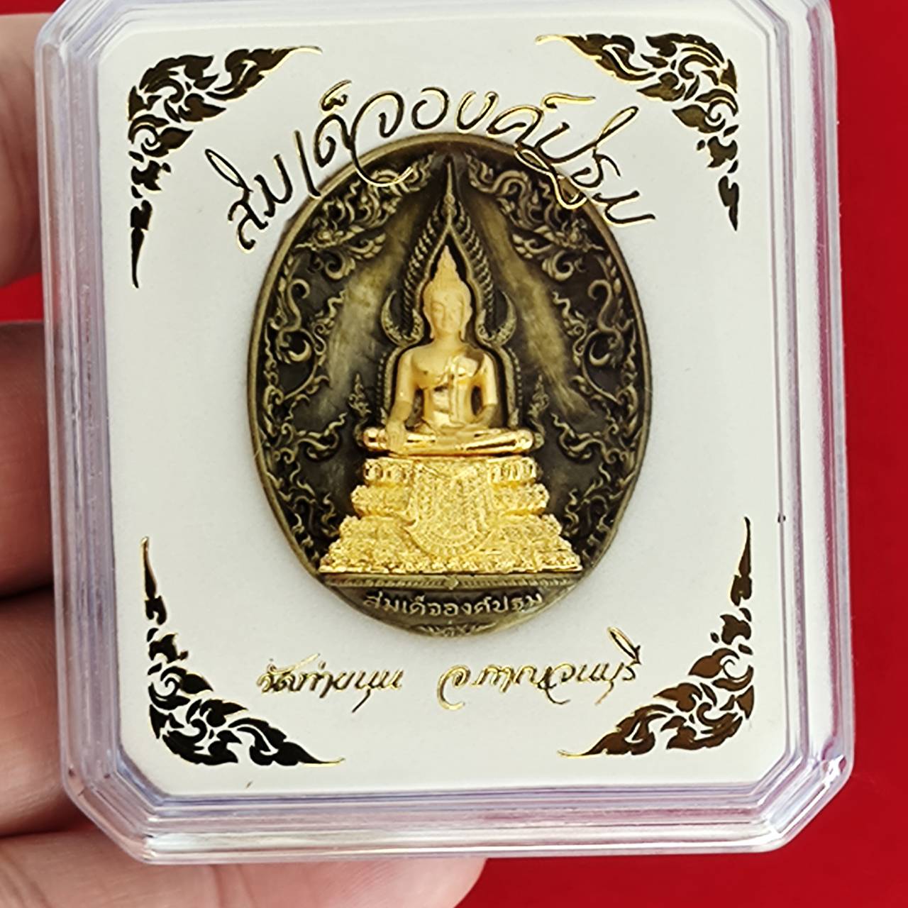 Thai protection fortune blessing charm featuring a Buddha statue in intricate gold design