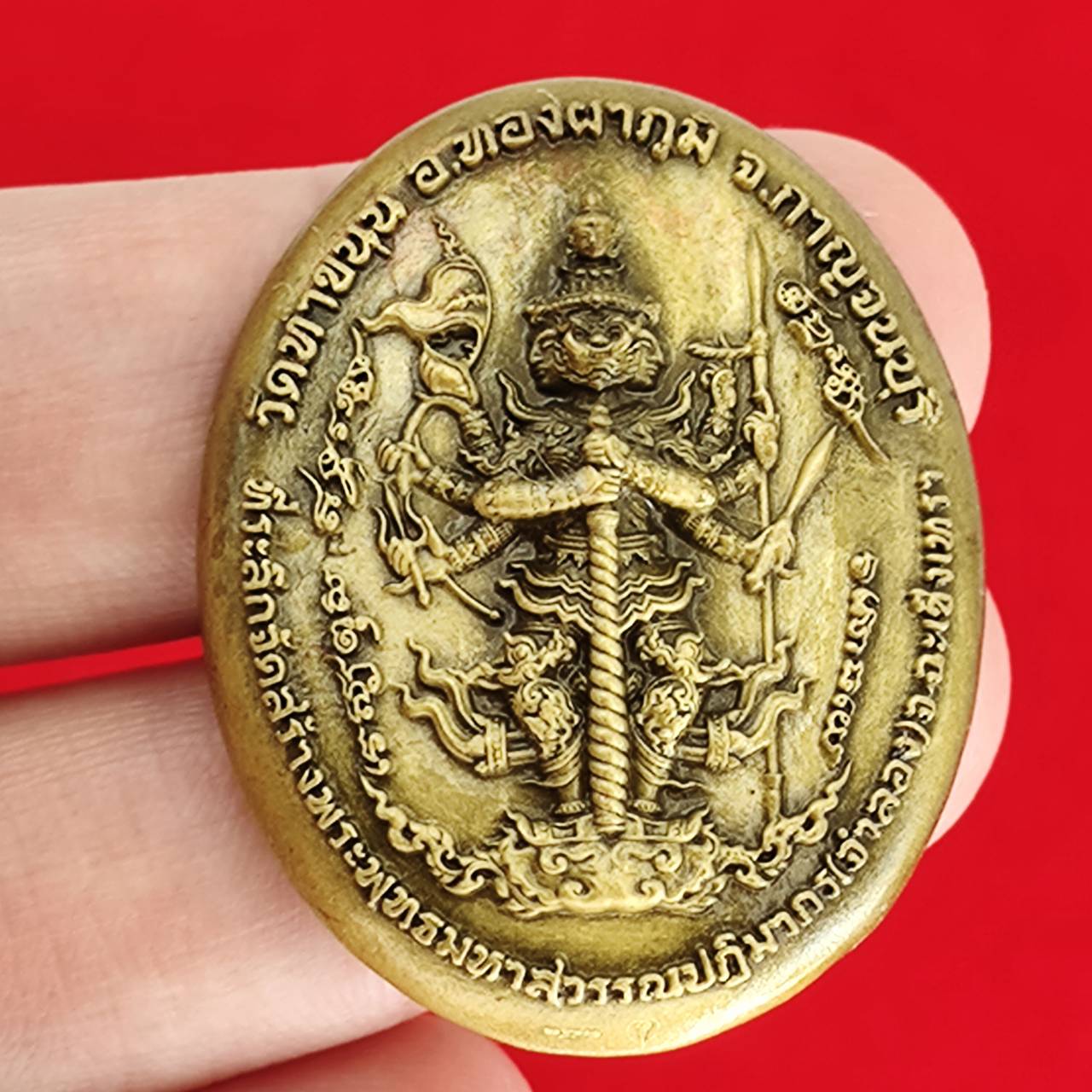 Thai protection fortune blessing charm in gold with intricate design for home decor and spiritual belief