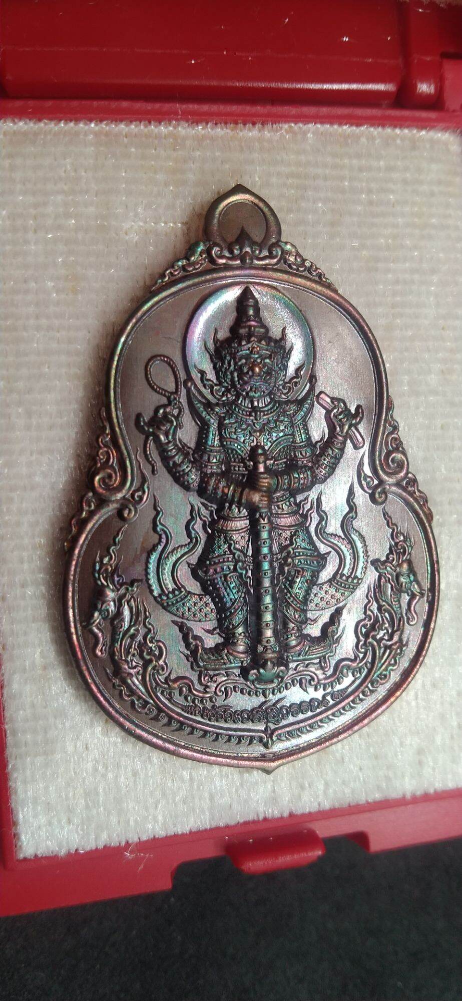 Thai protective talisman for wealth featuring a detailed guardian deity statue in metal from Thai Blessing Co