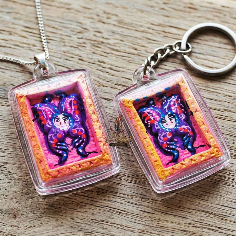 Authentic Thai Mini Butterfly King Amulet "Thep Chamlaeng Pamorn Purple Butterfly on Pink Background Hand-Painted Pendant" Consecrated by Khru Ba Krissana, Samnak Song Weruwan, Nakhon Ratchasima B.E. 2562 (2019)