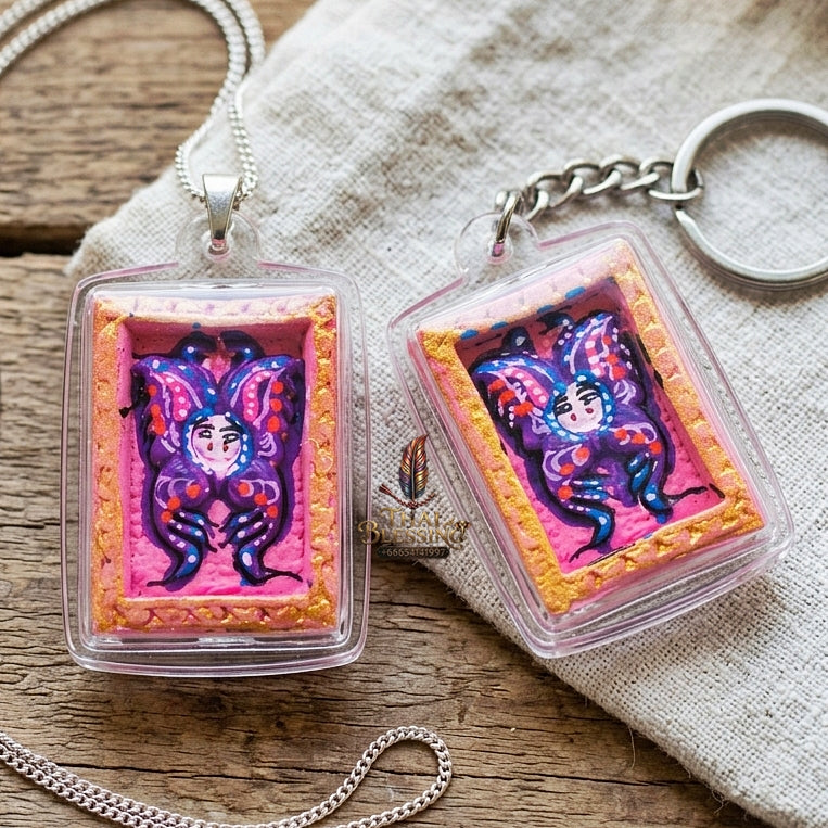 Authentic Thai Mini Butterfly King Amulet "Thep Chamlaeng Pamorn Purple Butterfly on Pink Background Hand-Painted Pendant" Consecrated by Khru Ba Krissana, Samnak Song Weruwan, Nakhon Ratchasima B.E. 2562 (2019)