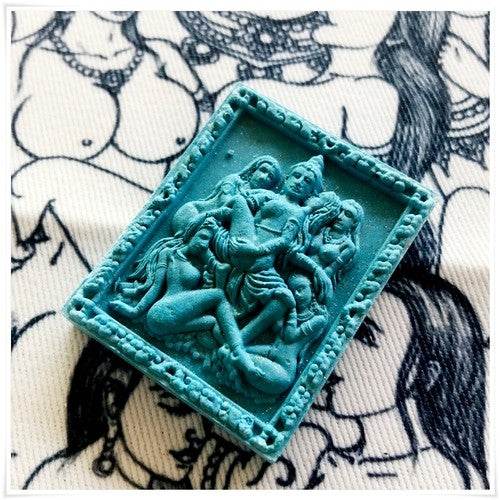 Thai seduction charm talisman featuring intricate details and vibrant blue color for spiritual enhancement