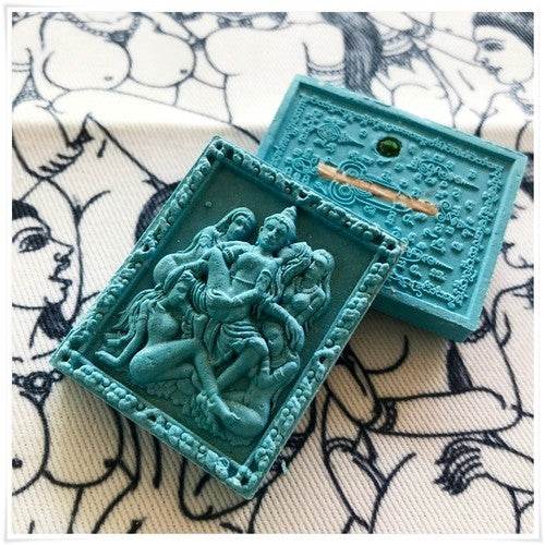 Thai seduction charm talisman with intricate design and spiritual symbols for positive energy