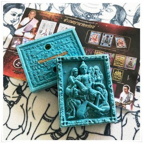 Thai seduction charm talisman in blue with intricate design, used for feng shui and spiritual practices