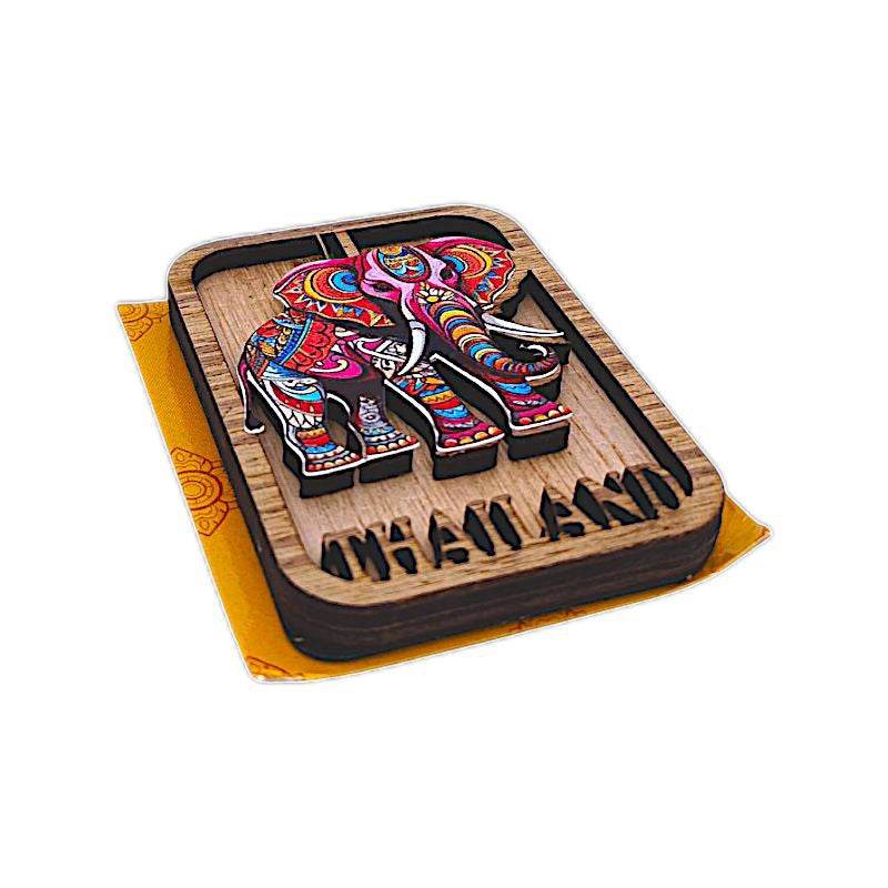 Colorful wooden elephant Thailand souvenir magnets with intricate patterns and carved Thailand text