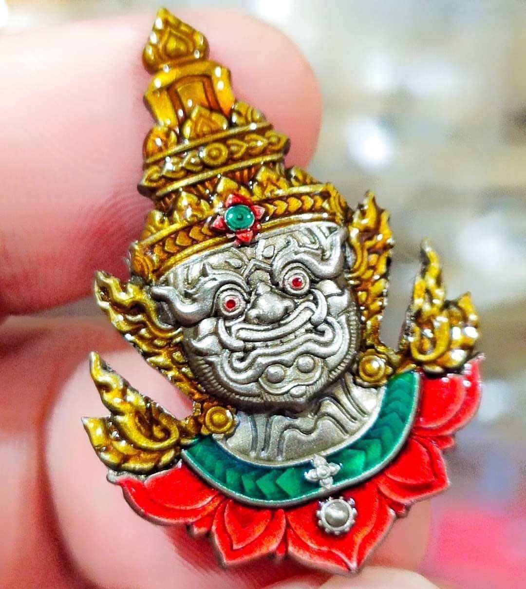 Thai Tao Wessuwan amulet with intricate details and vibrant colors, symbolizing protection and prosperity.