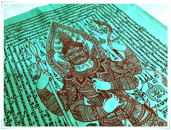 Thao Wessuwan yantra cloth green fabric with brown guardian deity print and rows of sacred Thai script