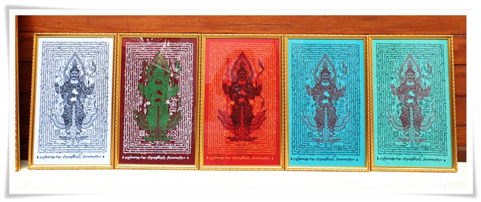 Thao Wessuwan yantra cloth set five framed colorful protective amulet cloths displayed on wooden shelf