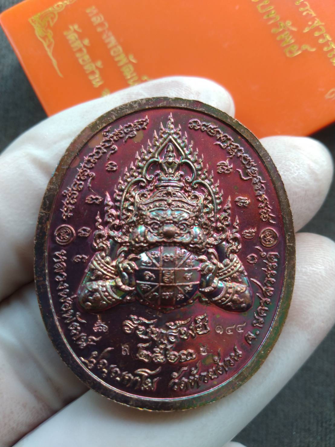 Thai Blessing Co oval red metallic Thao Wessuwan wealth amulet pendant with detailed deity engraving