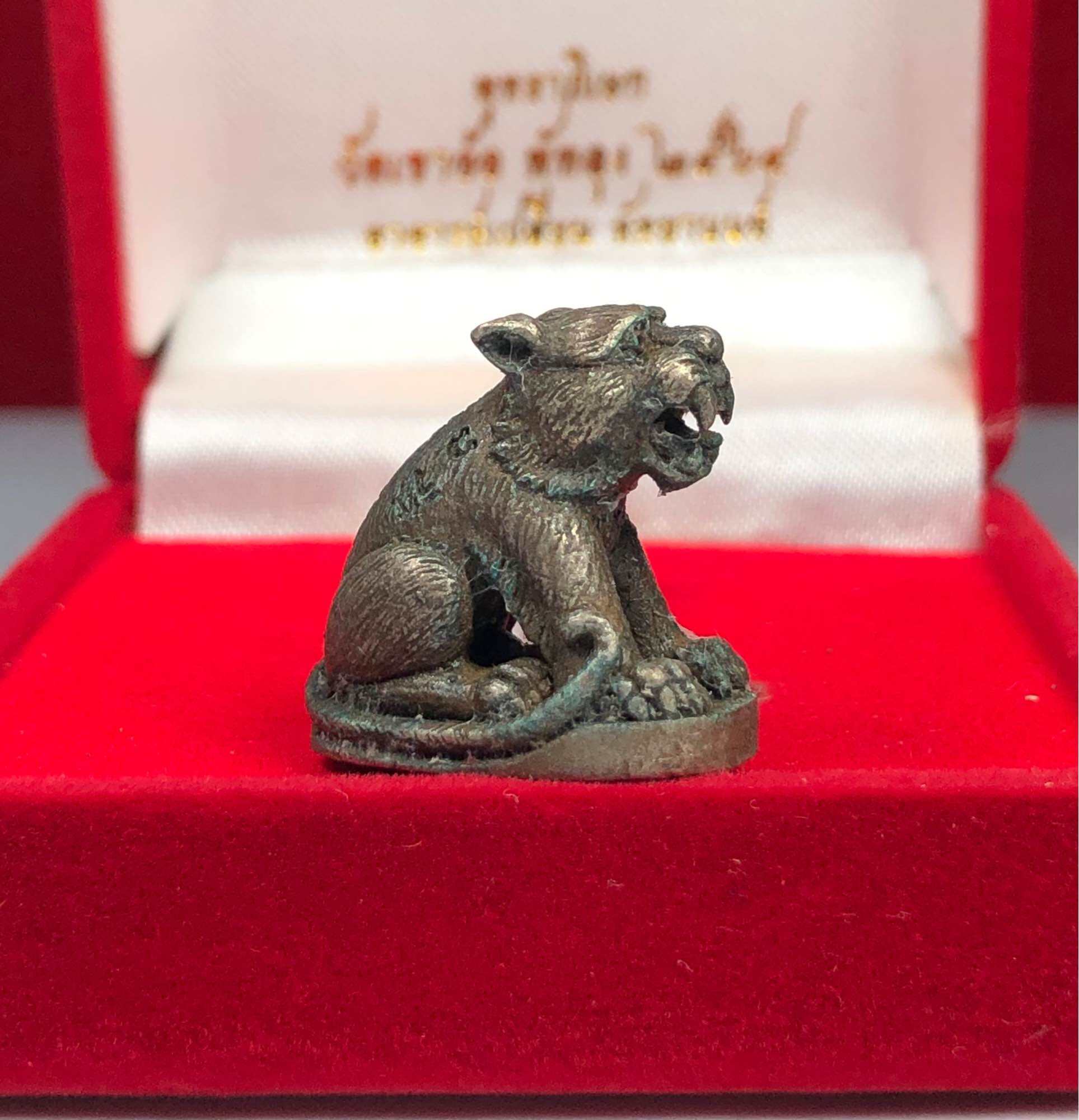 Thai tiger amulet for protection small metal figurine displayed in red velvet box