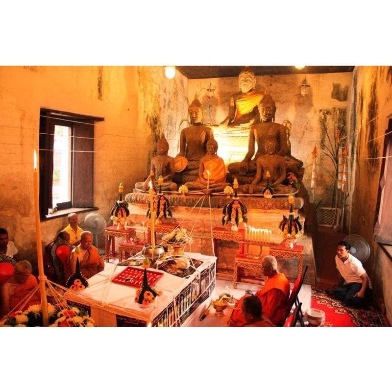 Buddhist shrine ceremony with monks, offerings and Tiger Takrud amulet for status elevation by Thai Blessing Co