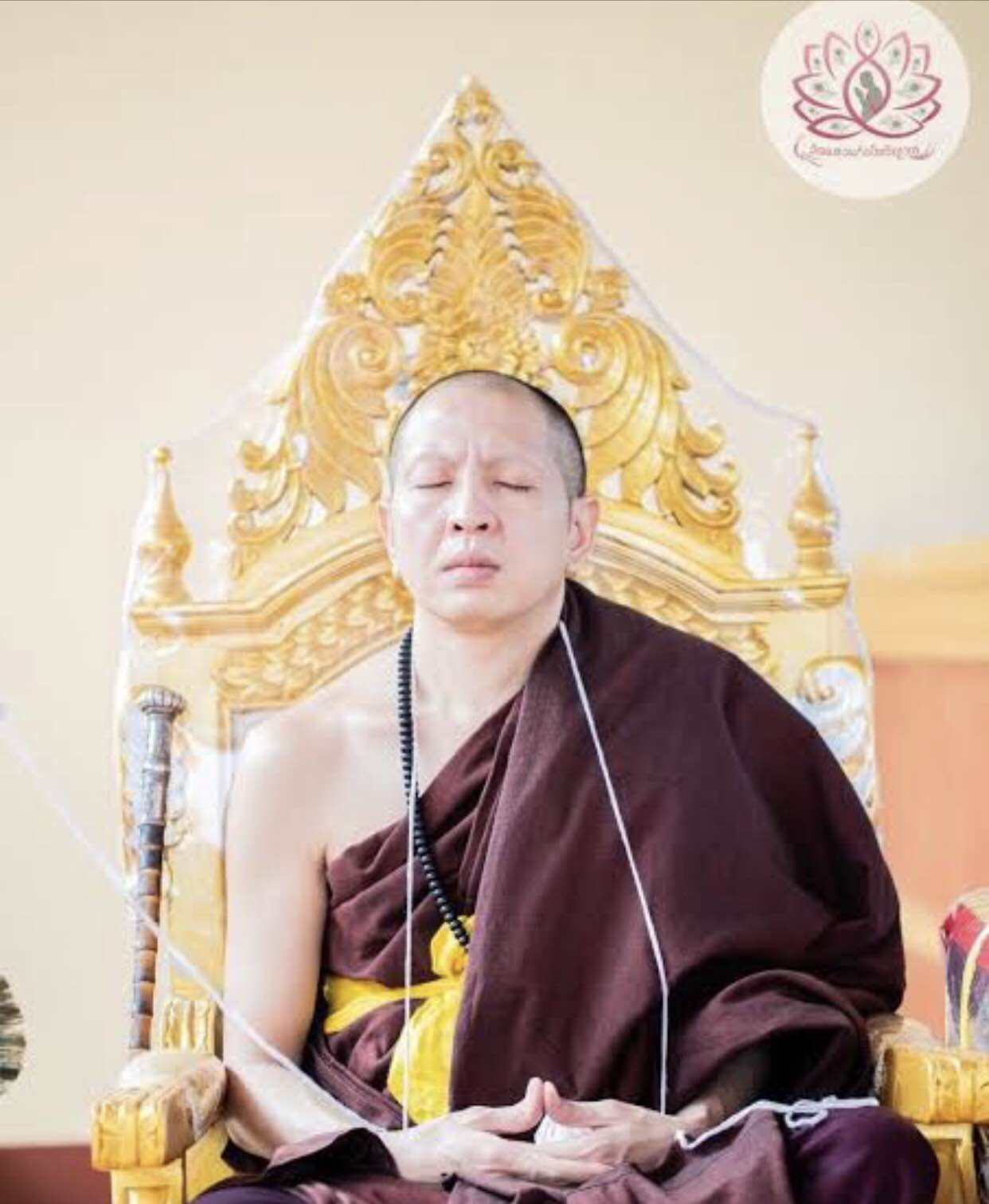 Thai wealth protection amulet blessed by a monk, ideal for attracting prosperity and fortune