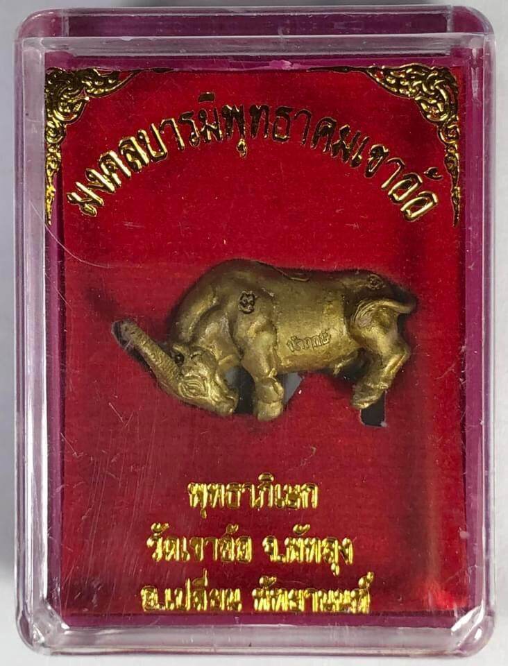 Kwai Thanhu Full Moon Edition Amulet brass buffalo in clear plastic case on red velvet backing with Thai script