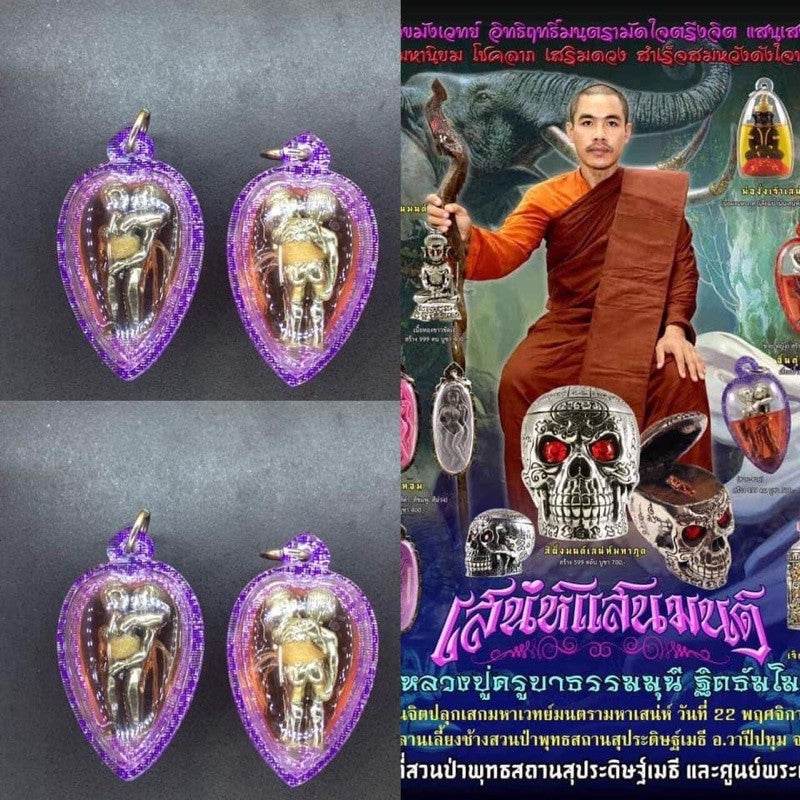 LGBTQ love attraction amulet purple encased Thai blessing pendant with silver figure and decorative robed poster background