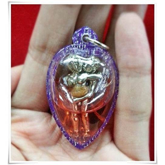 Thai Blessing Co purple teardrop pendant with silver embracing couple in resin LGBTQ love attraction amulet
