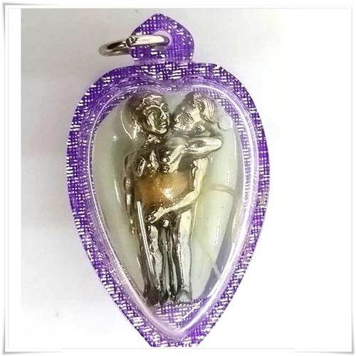 Purple cased Thai Blessing Co amulet showing a silver embracing couple figurine for romance LGBTQ love attraction amulet