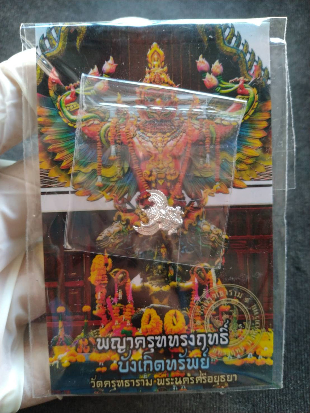 Thai Blessing Co mini Garuda amulet Thailand silver pendant in plastic bag on colorful Garuda shrine card