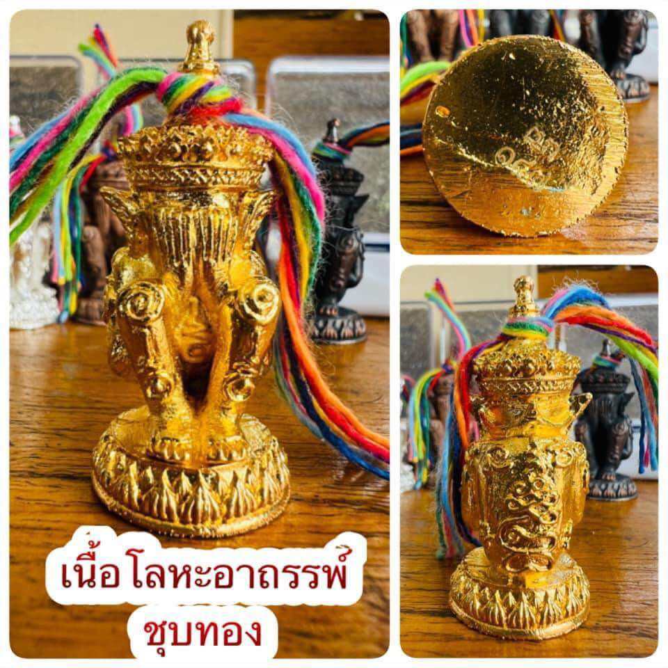 Norah Chatri Pi Takta amulet for protection. Thai gold statue with ornate pedestal and multicolor cords