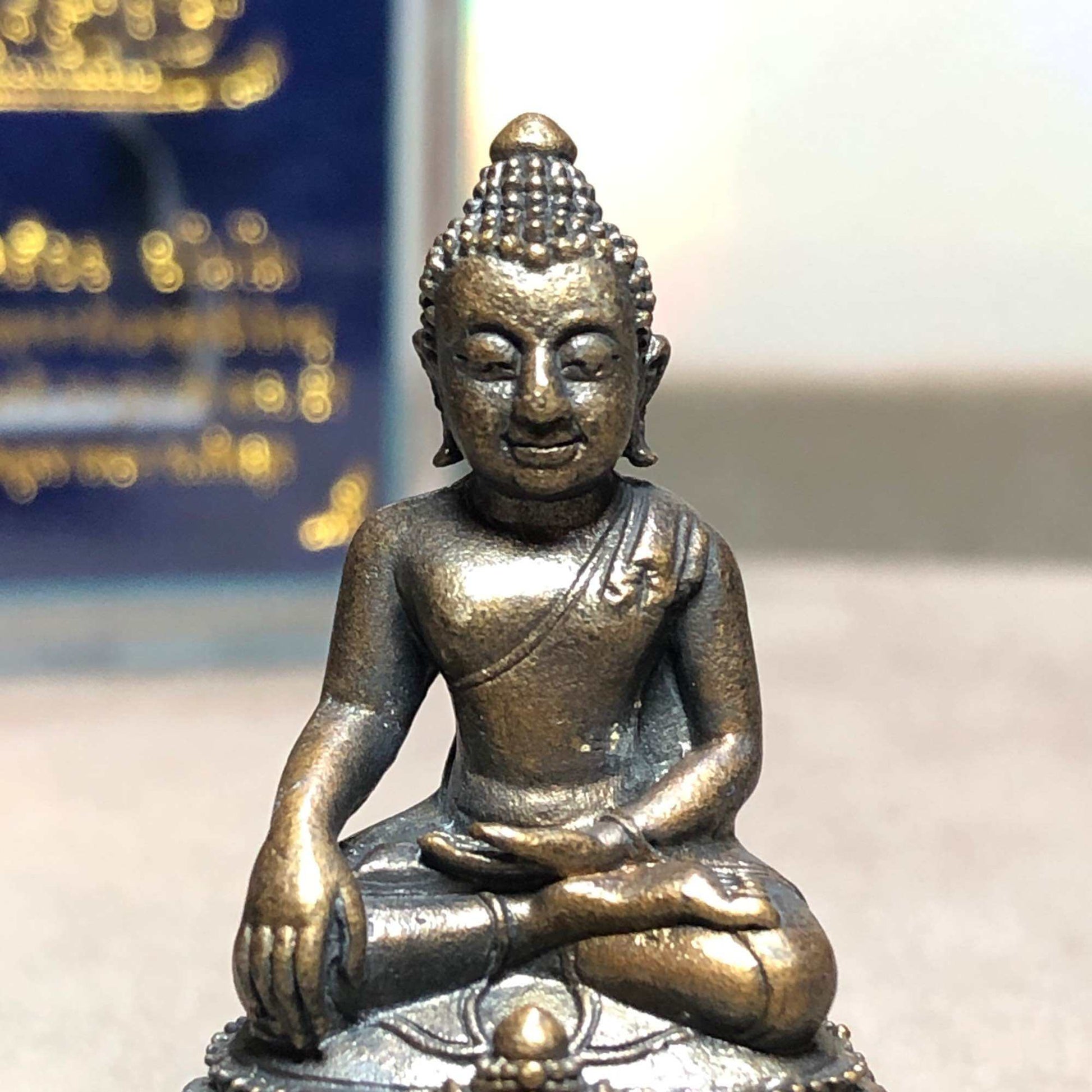 Phra Kring Srivichai amulet small seated bronze Buddha statue with detailed hair curls and meditation pose