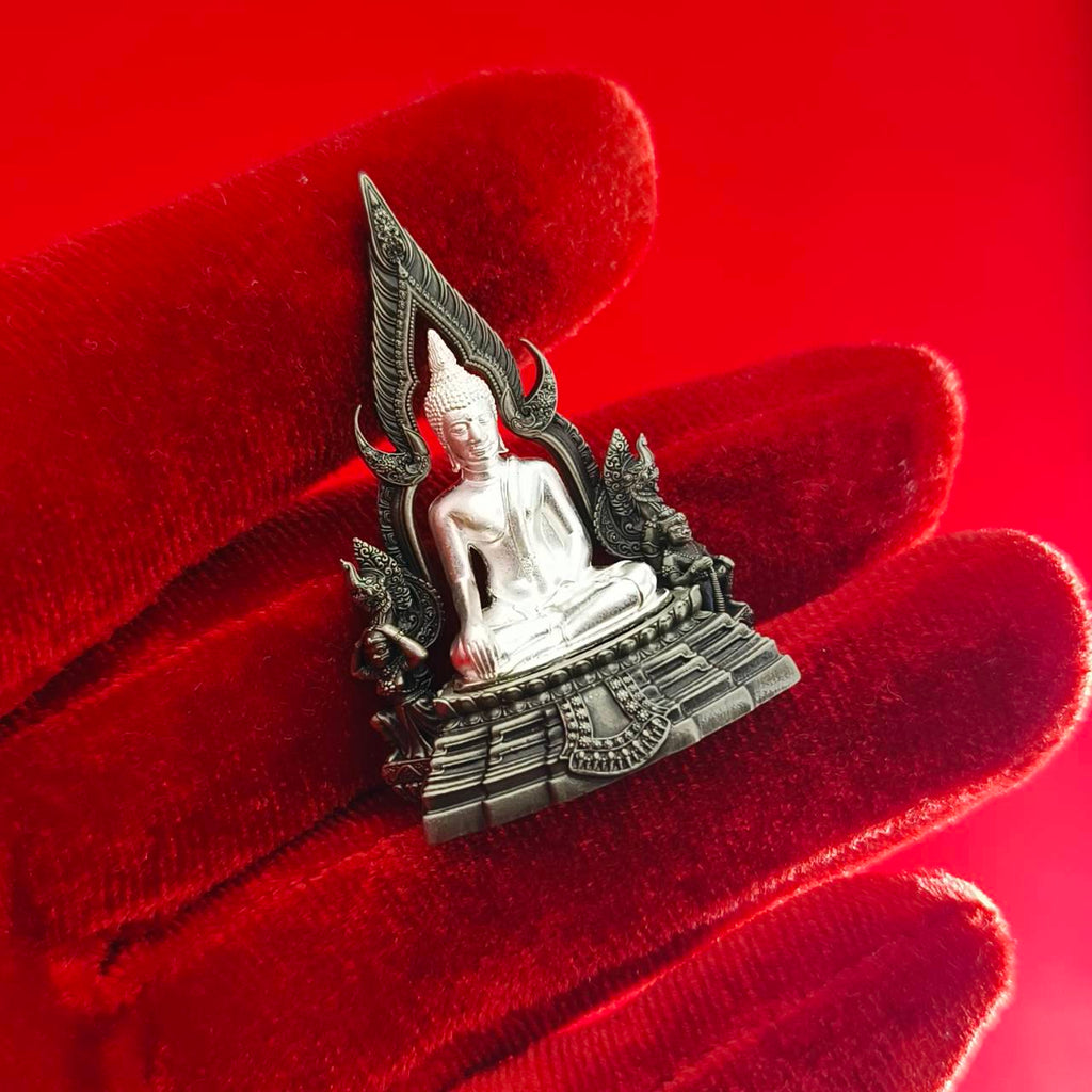 Thai Blessing Co Phra Phuttha Chinnarat amulet silver seated Buddha on ornate base held on red velvet glove