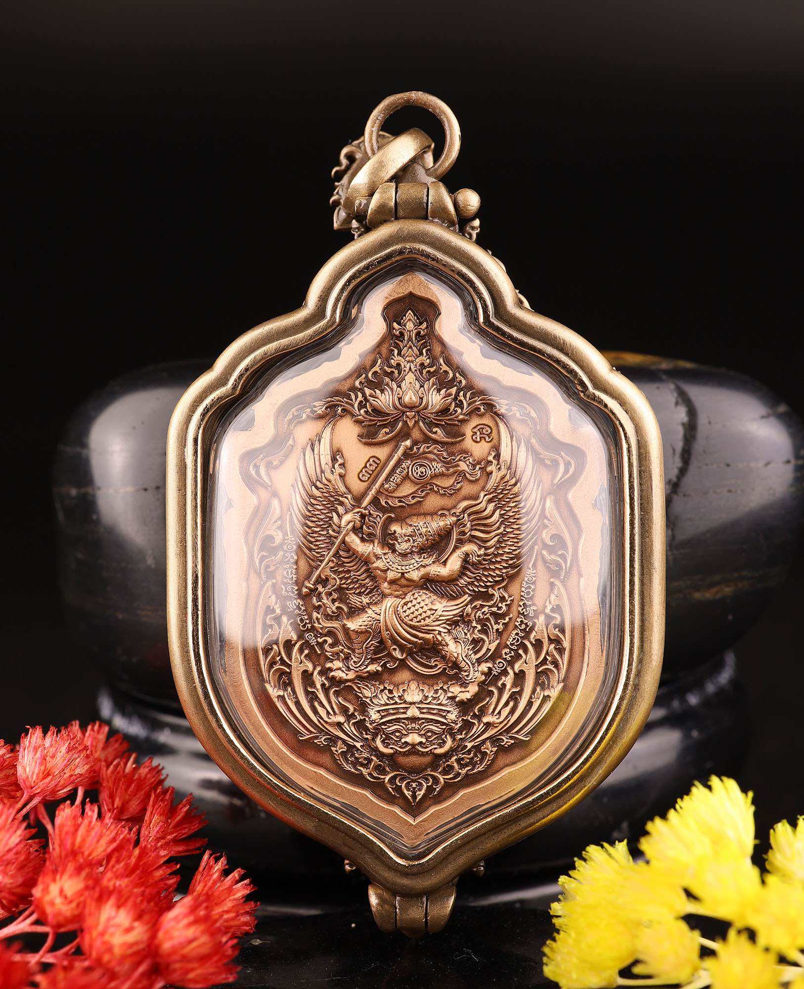 Thao Wessuwan amulet for protection bronze decorative pendant in ornate gold frame with red and yellow flowers
