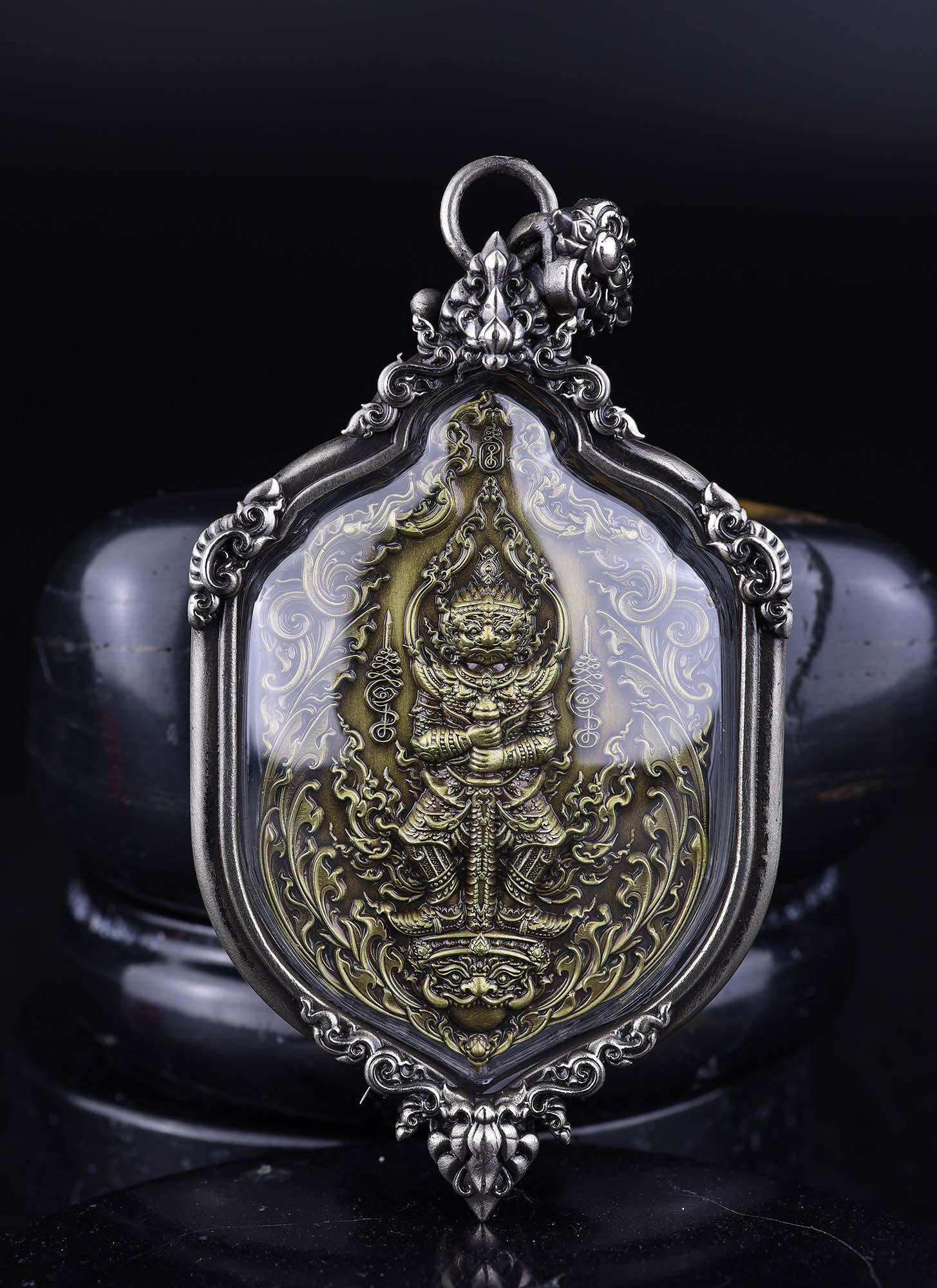 Thao Wessuwan amulet for protection ornate Thai pendant with gold toned guardian figure in silver frame
