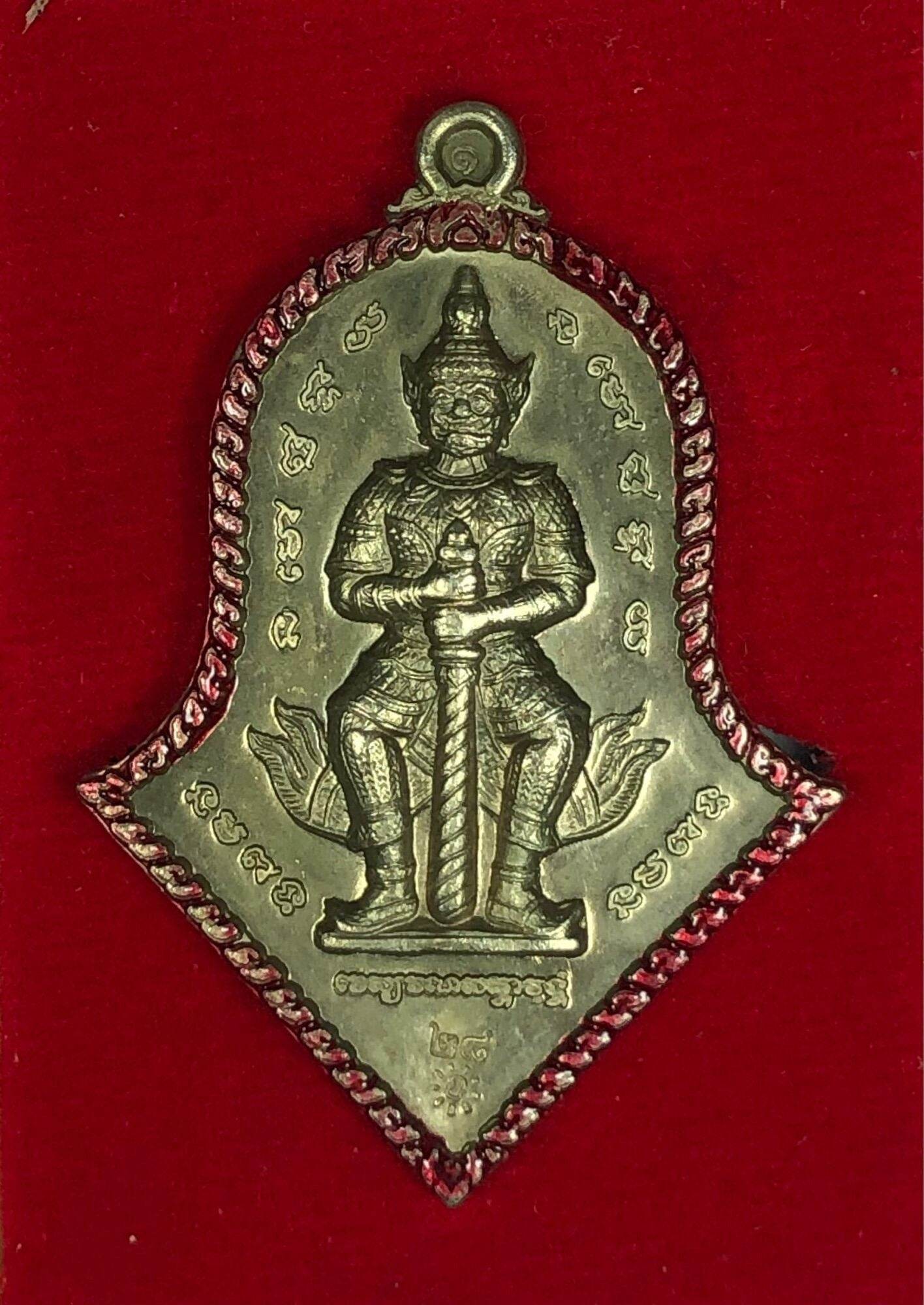 Thao Wessuwan Amulet bronze pendant with seated guardian holding sword and red braided cord border