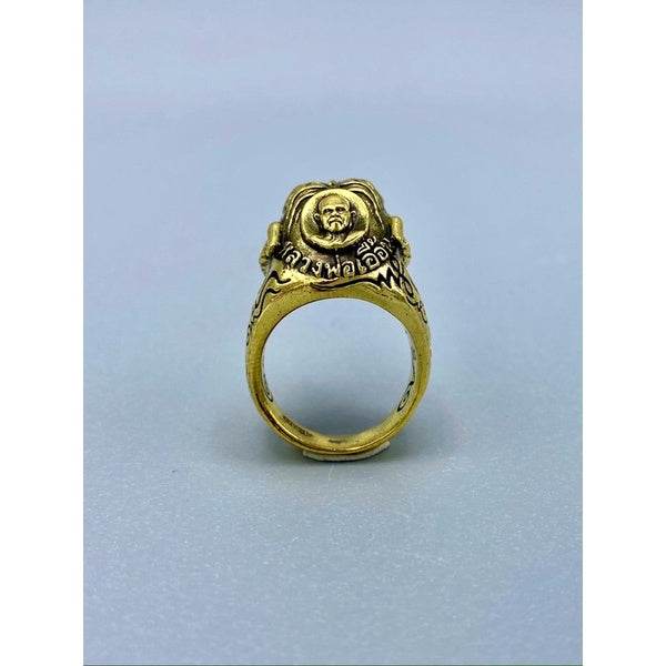 Gold brass Tiger King ring Thai amulet with carved monk face and intricate Thai script detailing