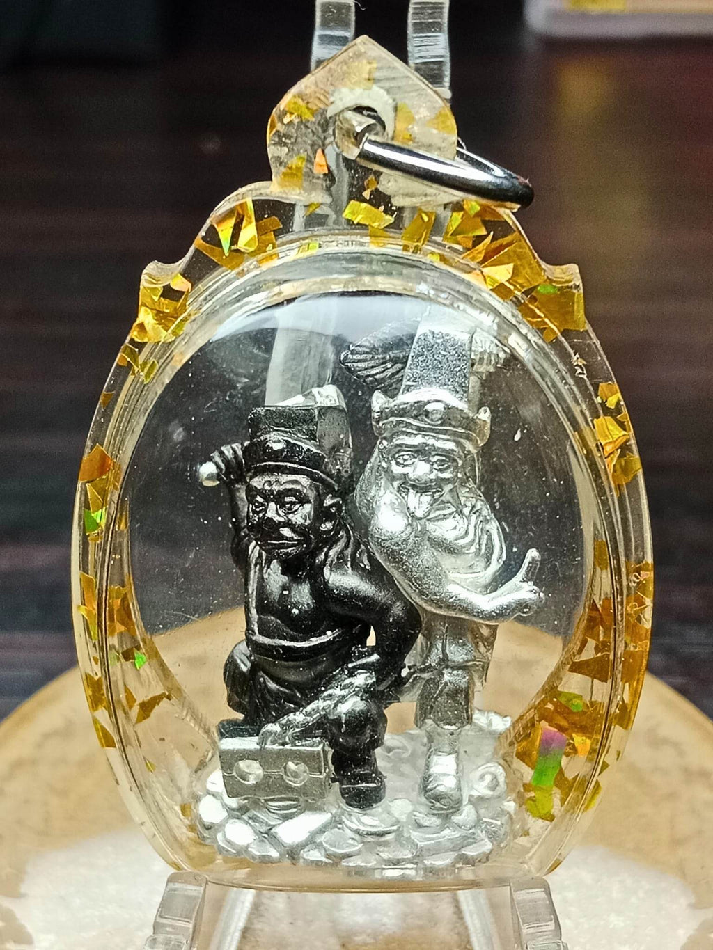 Tua Pae-Yee Pae Amulet - 2 Deities of Wealth silver figures in clear amulet case with gold flakes and metal keyloop
