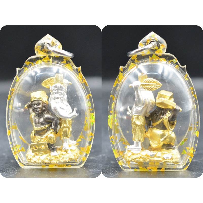 Tua Pae-Yee Pae Amulet - 2 Deities of Wealth clear resin pendant showing two gold and silver deity figures on coins