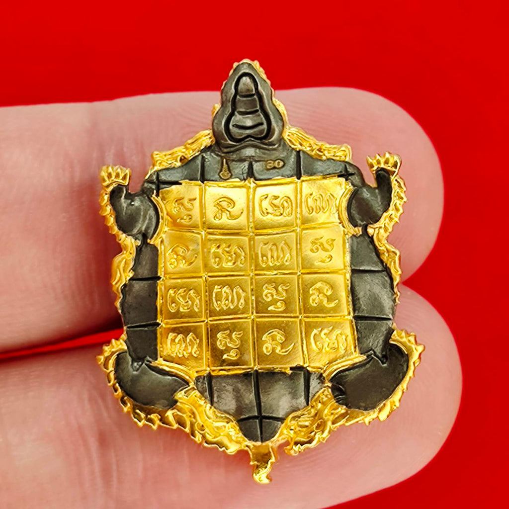 Kassapo Turtle wealth amulet gold and black turtle charm with engraved yantra grid and Thai script