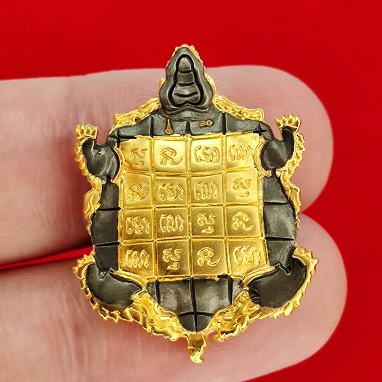 Kassapo Turtle wealth amulet gold and black turtle charm with engraved yantra grid and Thai script