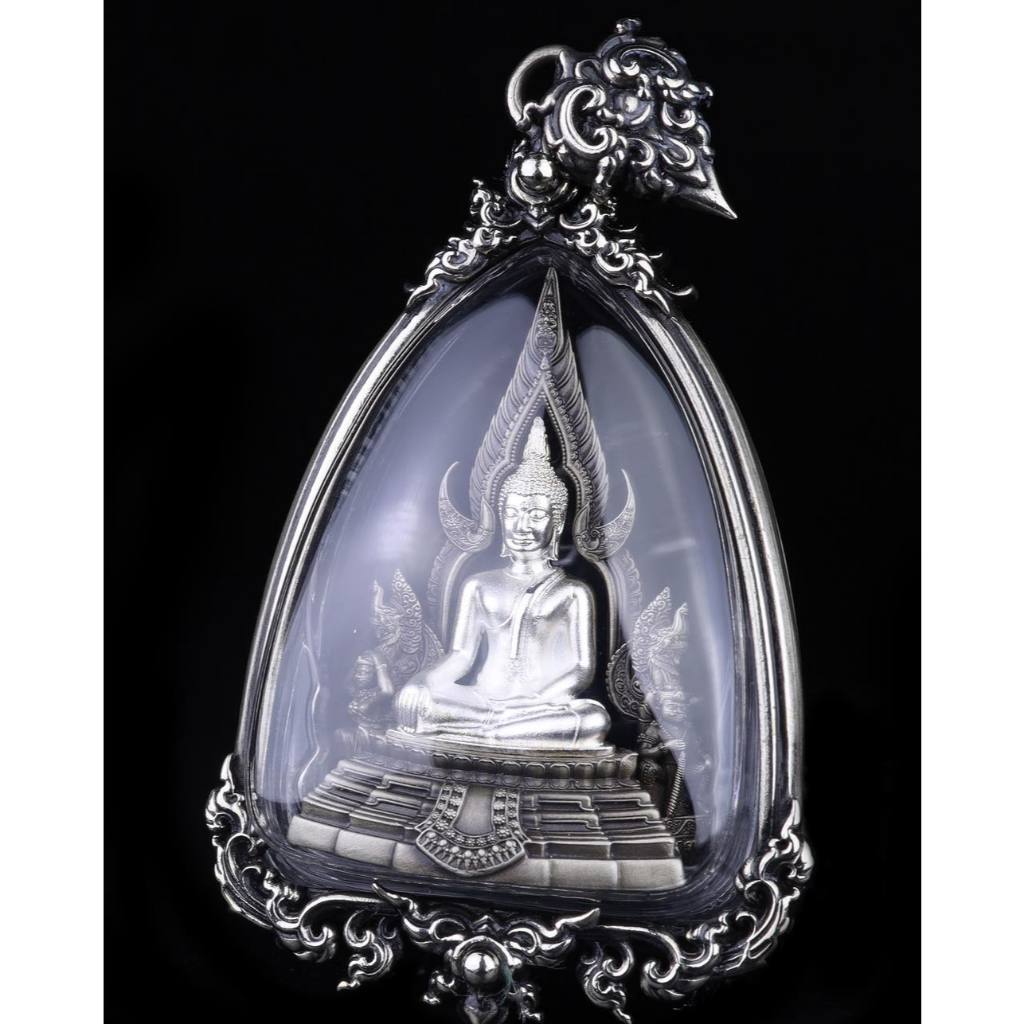 Phra Put Chinnarat amulet silver seated Buddha in ornate protective case with decorative frame pendant